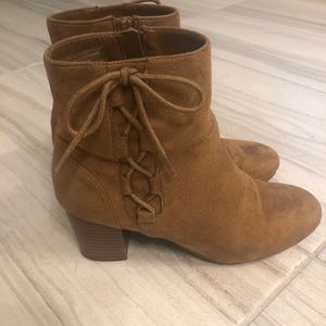 Brown booties with tied bows